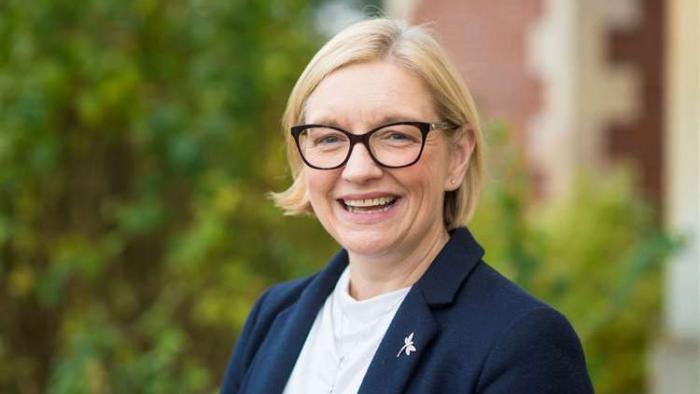A woman smiling